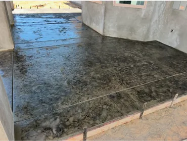 Completed custom backyard improvement with concrete features