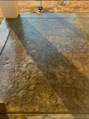 Decorative concrete with a custom stamped and colored finish