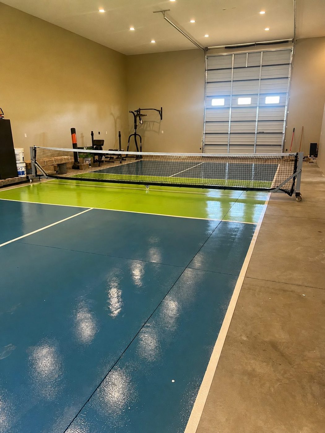Indoor pickleball court built inside a custom residential garage
