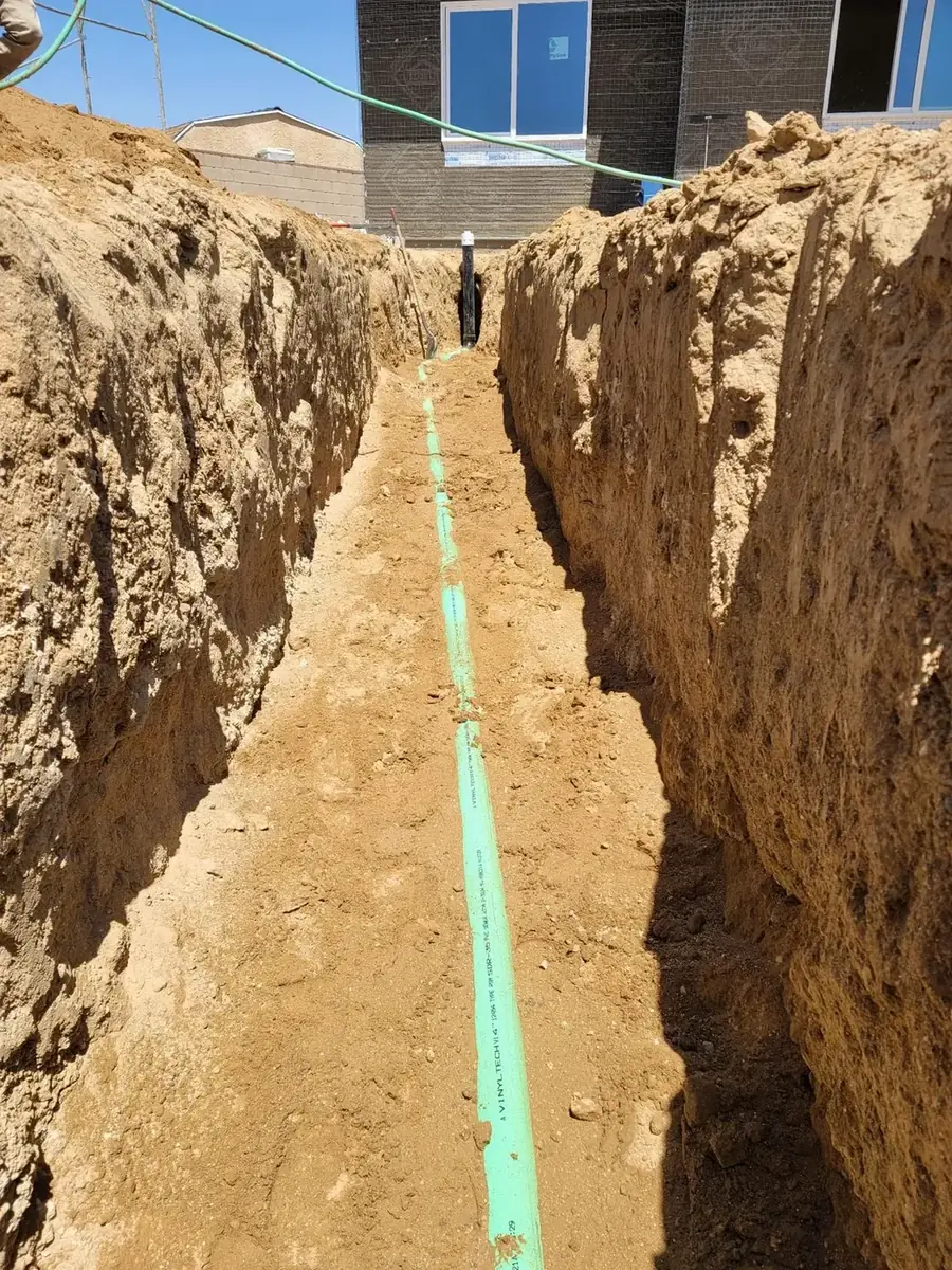 Excavated trench prepared for sewage utility installation
