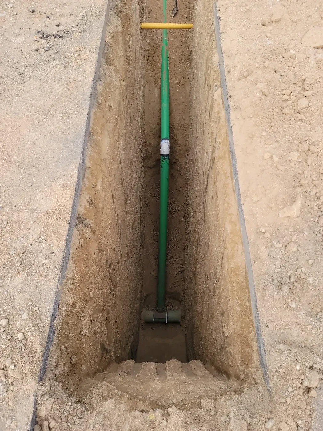 Sewer line tap work being completed underground