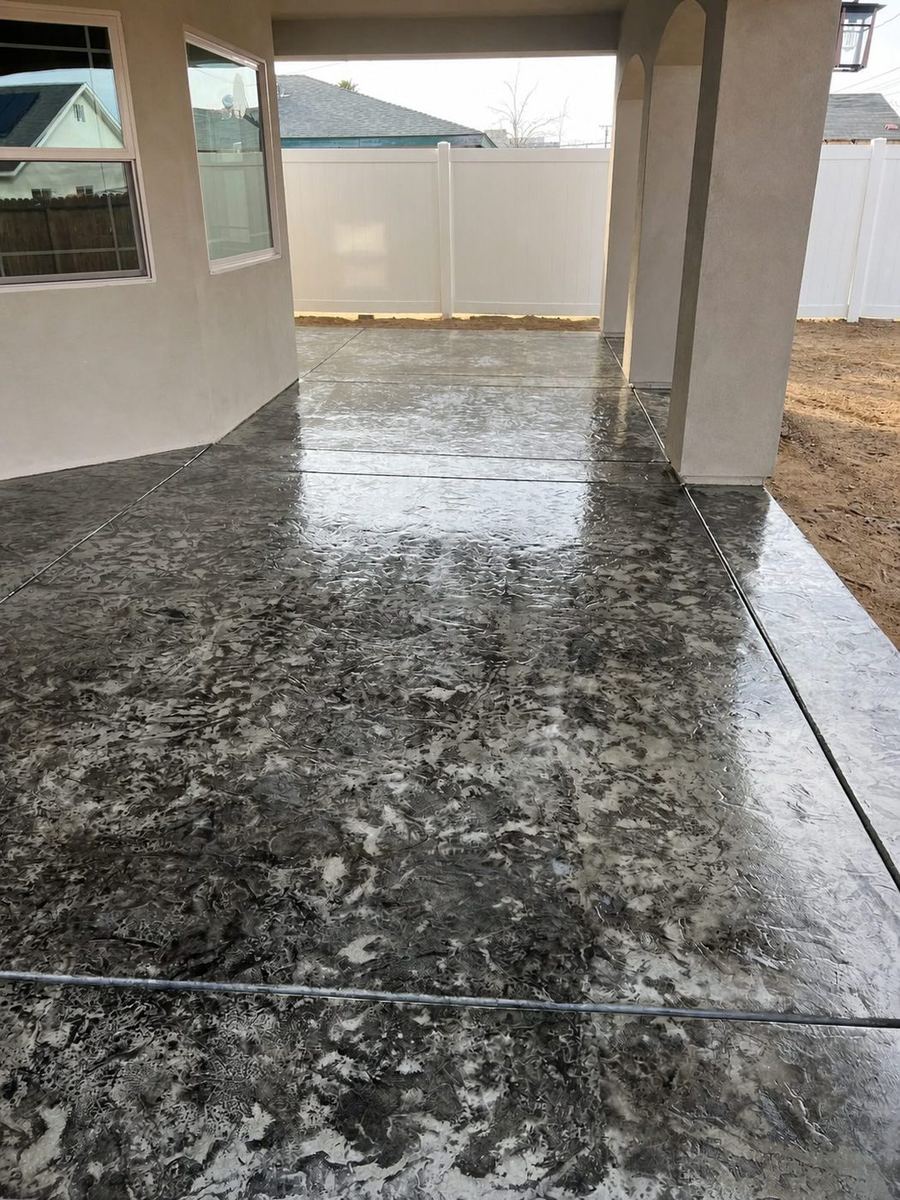 Stamped concrete patio under a covered structure, built by High Desert Development